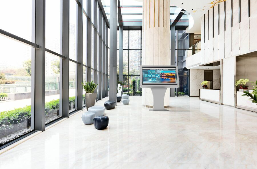 Duraline Angled Kiosk in silver in a bright office lobby
