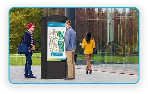 Outdoor digital wayfinding pillar guiding visitors in a public civic space